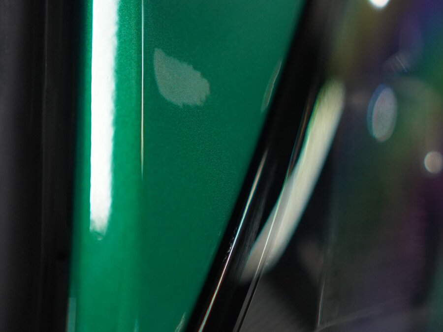 Close-up detail of paint protection film finish on a vehicle door