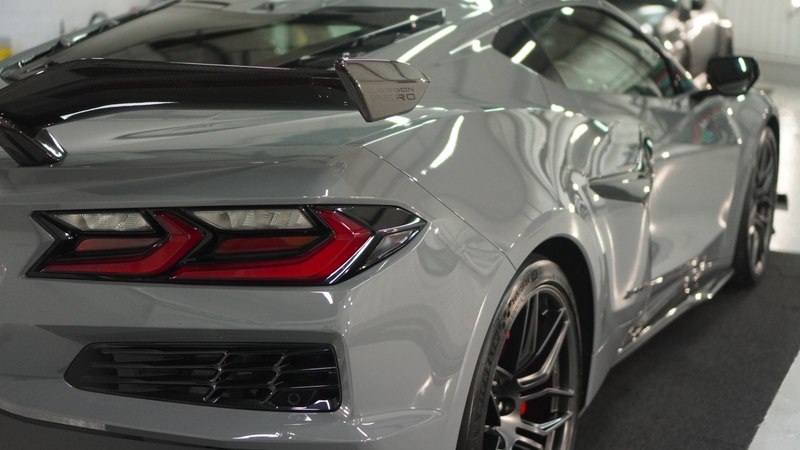 Car bodywork showing a paint protection film coverage boundary line