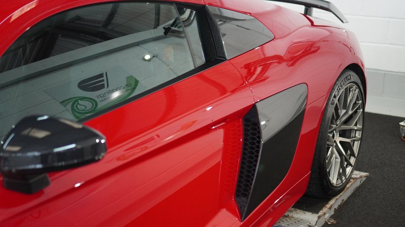 Glossy car paintwork finished with paint protection film, compared to ceramic coating