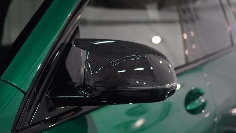 Close-up of clear paint protection film applied to a car's bodywork